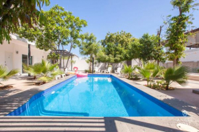 Cozy Stay with Pool BBQ Steps from Hotspots